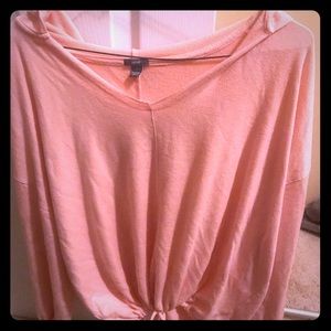 Loose fitting peach colored sweater